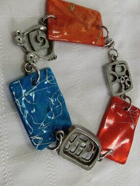Magnificent vintage statement bracelet with metalwork and colored pieces
